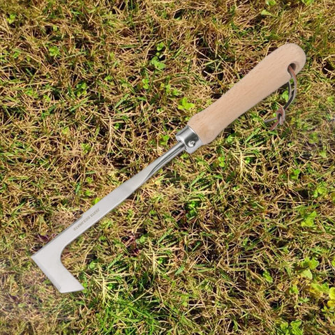 QWLWBU Crack Weeder in use along garden edging.