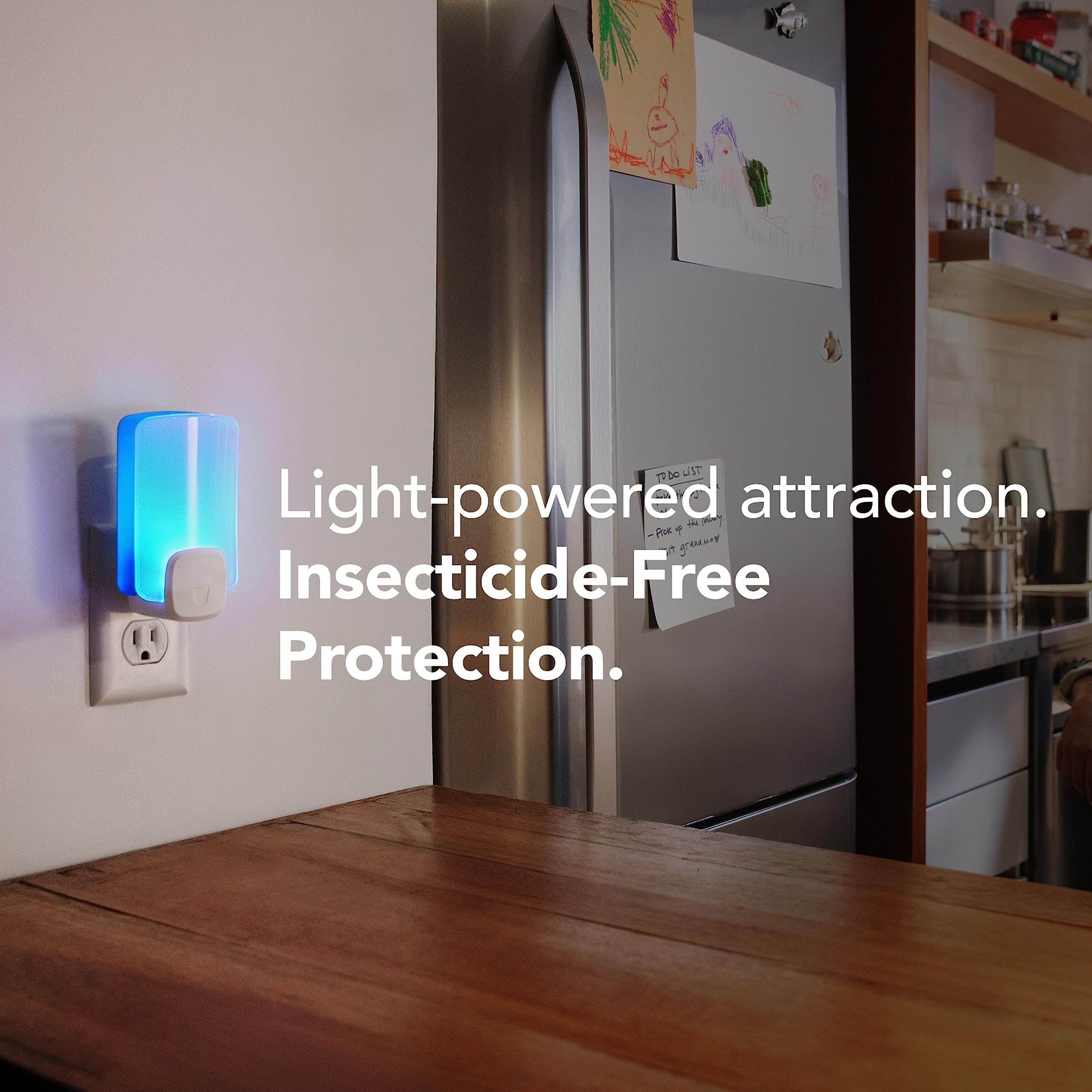 Raid Essentials plug-in light-trap unit with refill for room-ready pest control.