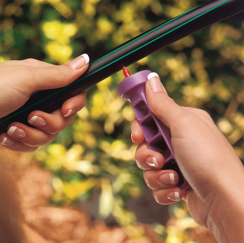 Rain Bird emitter tool handle with notches for easy removal of fittings.