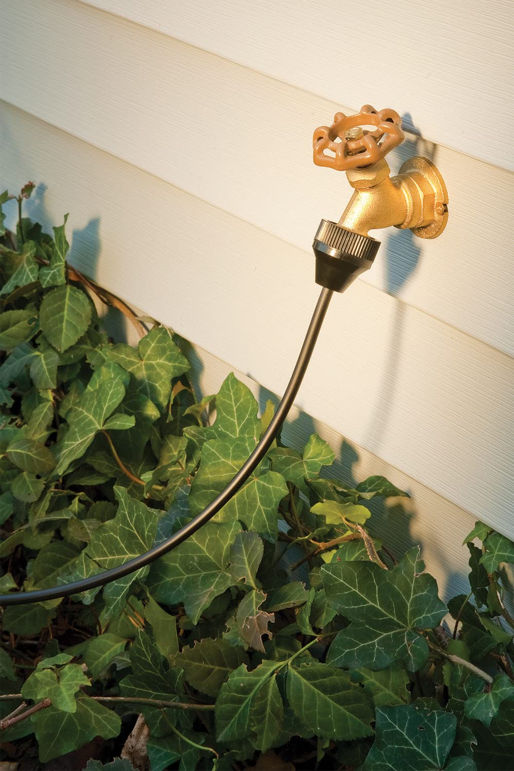 Rain Bird PATIOKIT 1-0 GPH emitter installed for gentle planter watering.