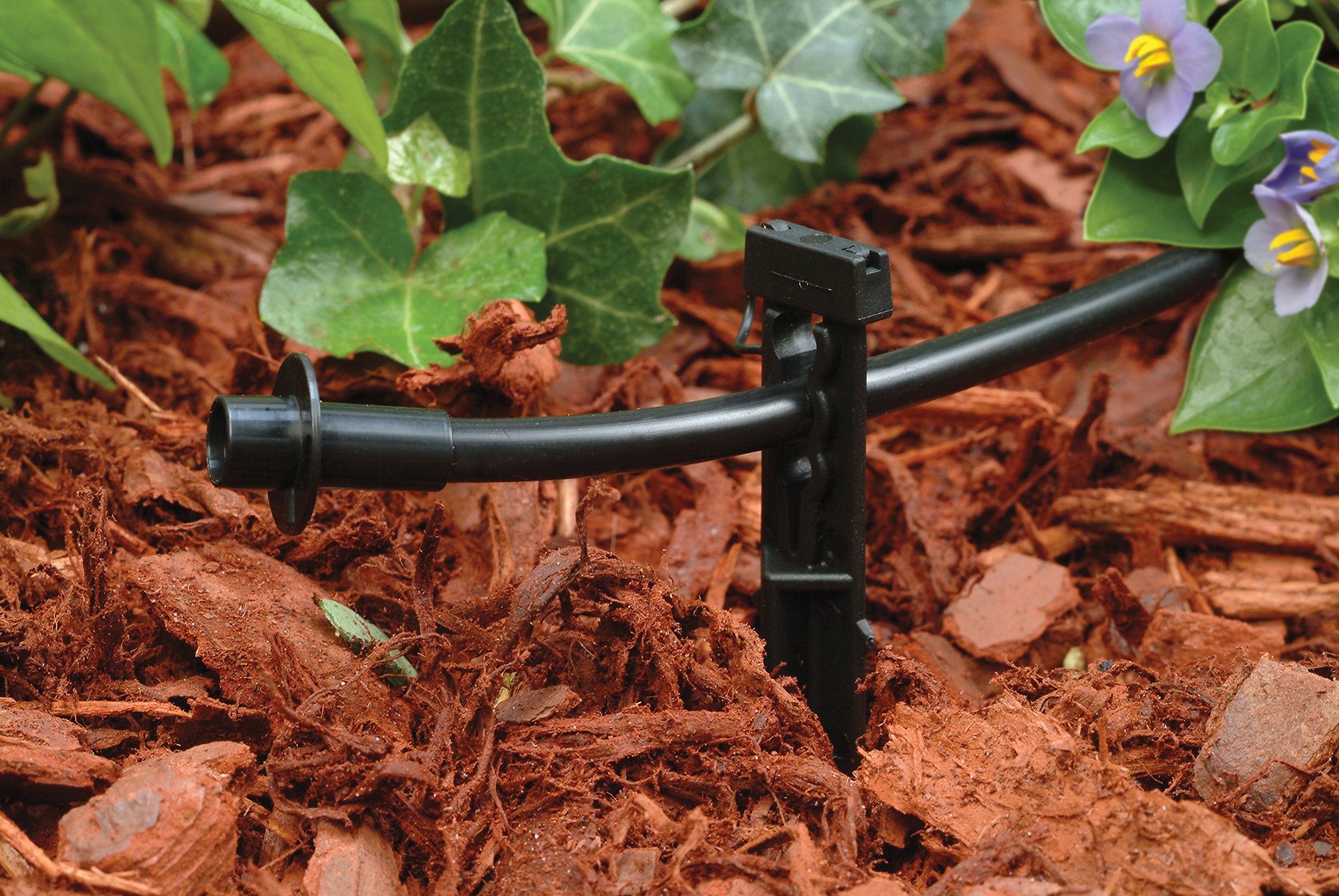 Rain Bird PATIOKIT bug caps protecting tubing ends from insects.