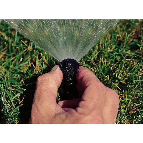 Rain Bird nozzle adjustment dial closeup highlighting easy pattern control for even coverage.