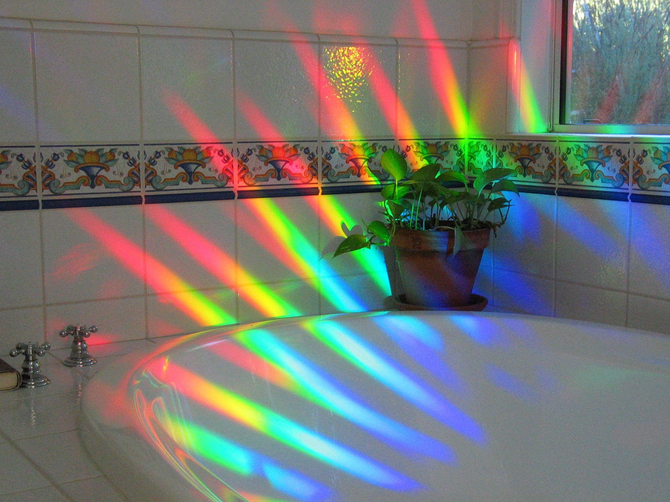 Rainbow Symphony Four-inch Suncatcher for window fills spaces with rainbow glow