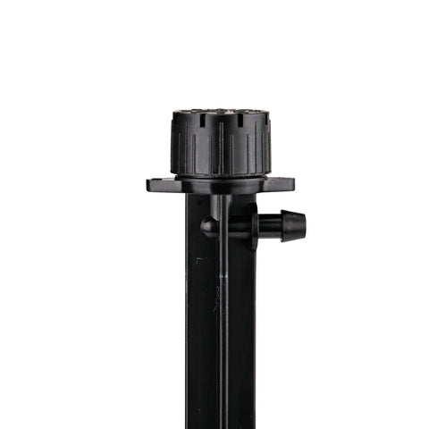 Raindrip 156005B 1/4 inch barbed inlet connected to tubing.