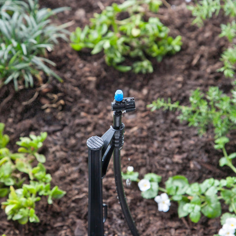 Raindrip half-circle spray covers beds evenly for efficient irrigation.