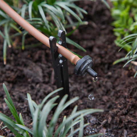 Raindrip PC4050B emitter with tubing attachment enables easy 1/4 in to 1/2 in connections.