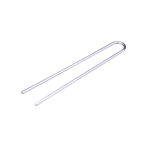 Raindrip R396CB tubing hold-down stake securing irrigation tubing near plant roots for stable watering.