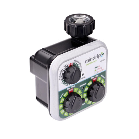 Raindrip R675CT timer mounted on outdoor faucet for reliable drip irrigation control