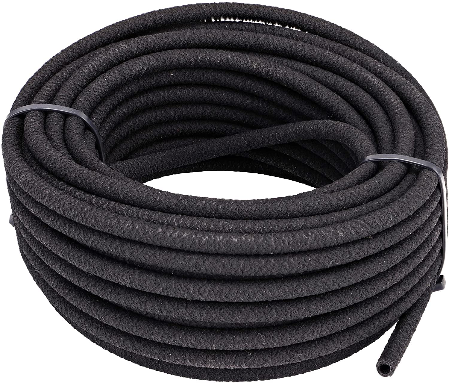 Raindrip soaker hose 50ft in garden delivers gentle soil hydration for vegetables