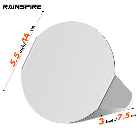 Rainspire burger press with flat base on griddle for even contact and sear.