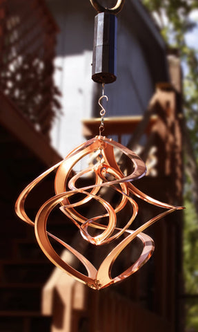 Red Carpet Studios Cosmix Copper Double Wind Sculpture spins independently for layered visual interest
