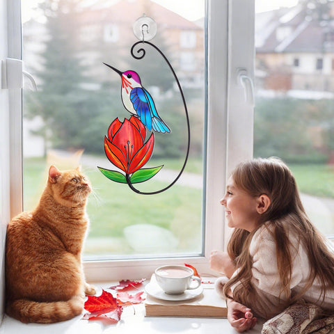 Remiawy blue hummingbird with red flower displays vibrant colors on sunny windows.