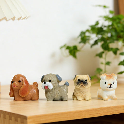 ResinGlow mini dogs perched on a planter for garden display
