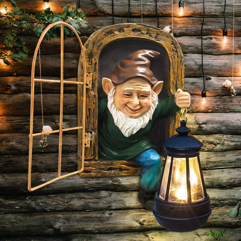 REYISO gnomes statue with solar lights brightens the fairy garden at night.