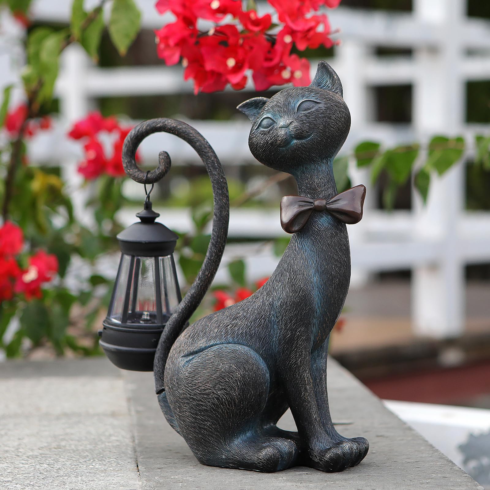 REYISO whimsical outdoor cat statue with solar lantern for charming garden lighting.