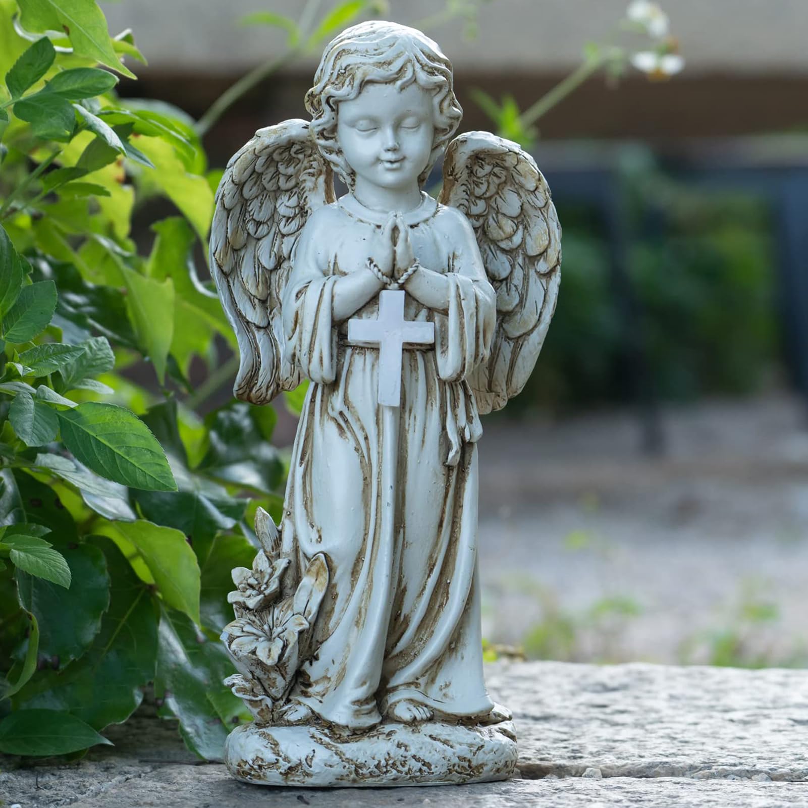 Rezpuao solar angel light illuminates garden paths after dusk.
