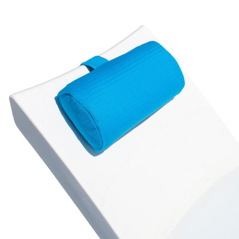 REZVANI headrest pillow on patio chaise lounge for outdoor comfort.
