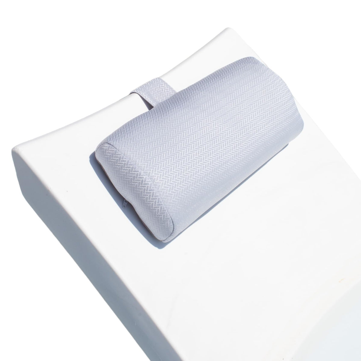 REZVANI Mountain Mist headrest pillow on a lounge for poolside relaxation.