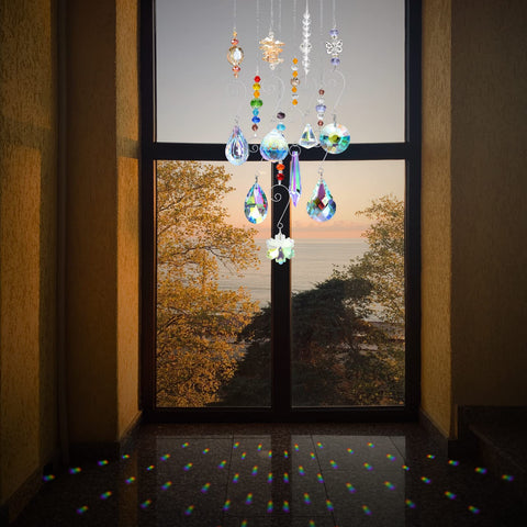 RIFNY crystal suncatchers hanging chain shown beside a sunlit window.
