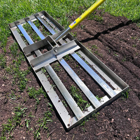 Rocklin Industry lawn leveling rake with ground plate showing stable balance for even surface