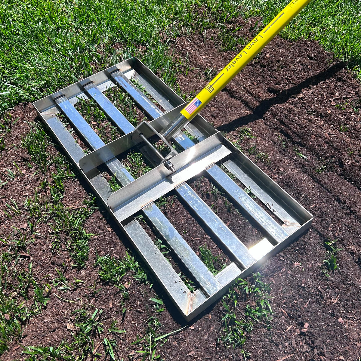 Rocklin Lawn Leveling Rake ground plate 22x10 in action smoothing uneven soil for a neater lawn