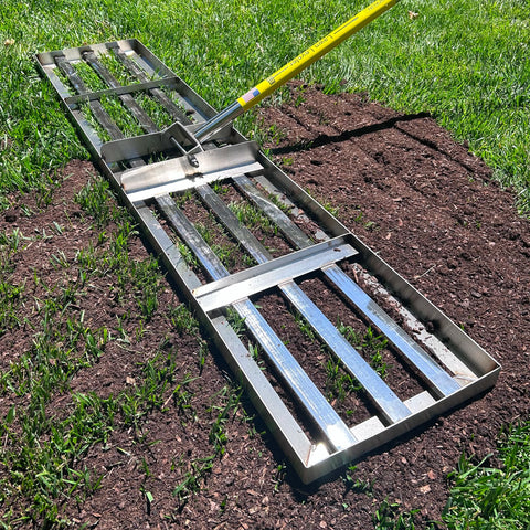 Rocklin Lawn Leveling Rake with wide ground plate enables fast smoothing across lawns.