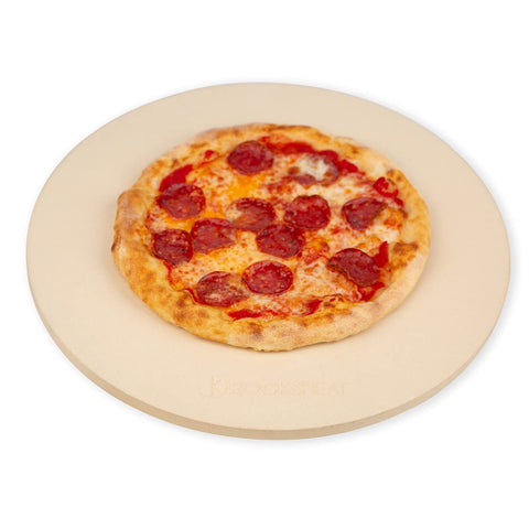 ROCKSHEAT round 16-inch pizza stone on a grill for even heat and crisp crust.