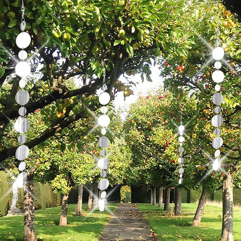Rodudu double-sided reflectors flash light across yard.