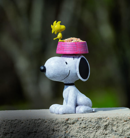 Roman Snoopy bird feeder for outdoor garden spaces and bird visits.