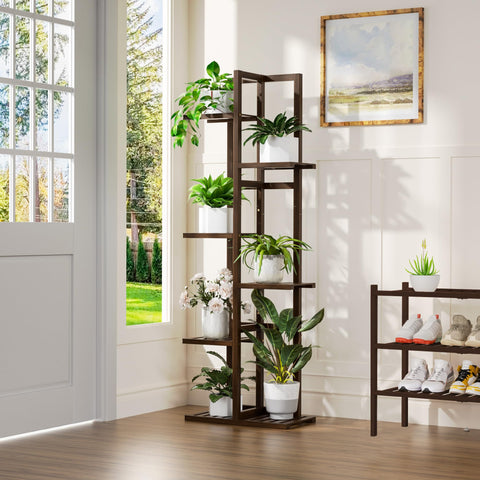 ROMGUAR CRAFT brown bamboo plant shelf shown in a cozy corner.