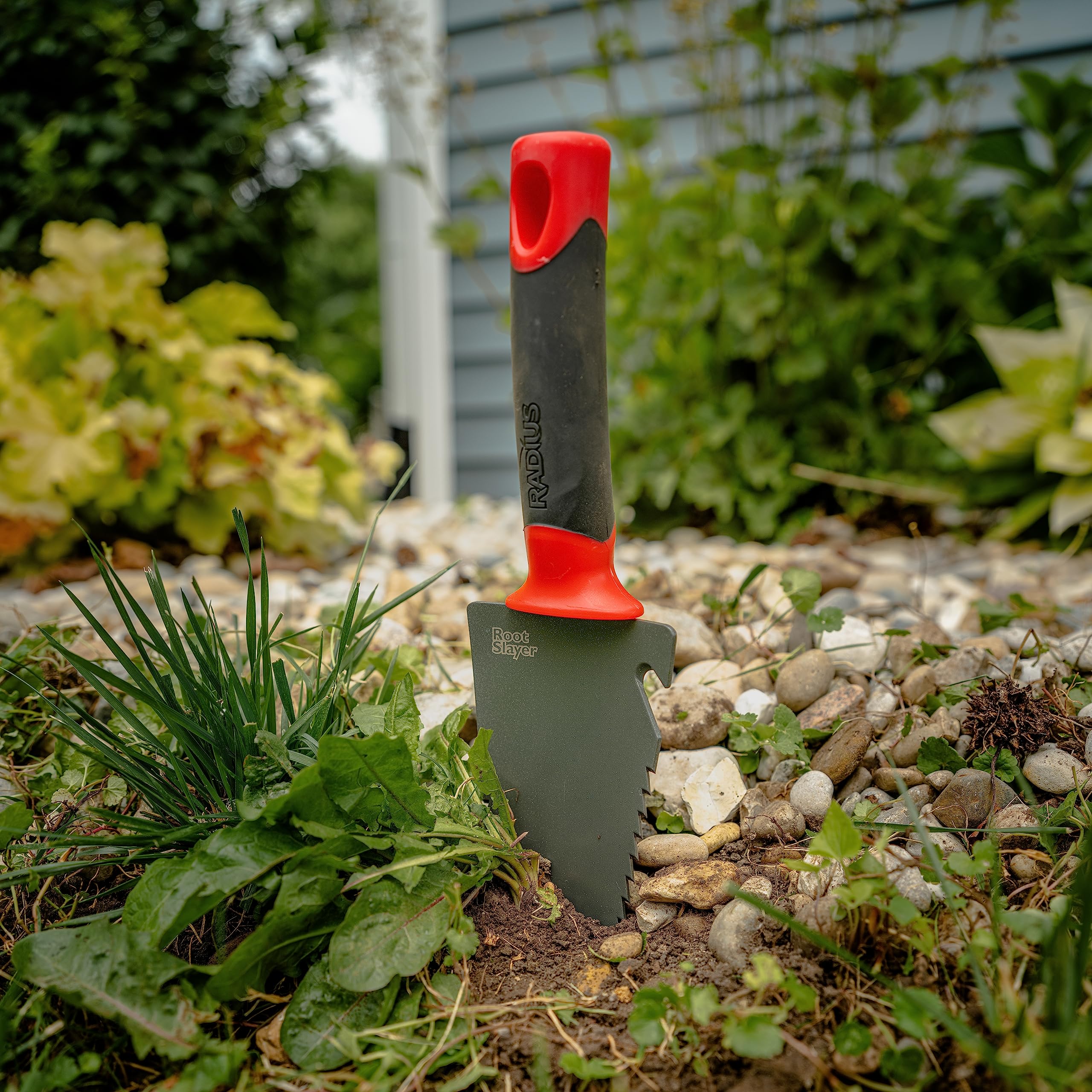Root Slayer trowel versatile tool for planting, weeding, and soil preparation.