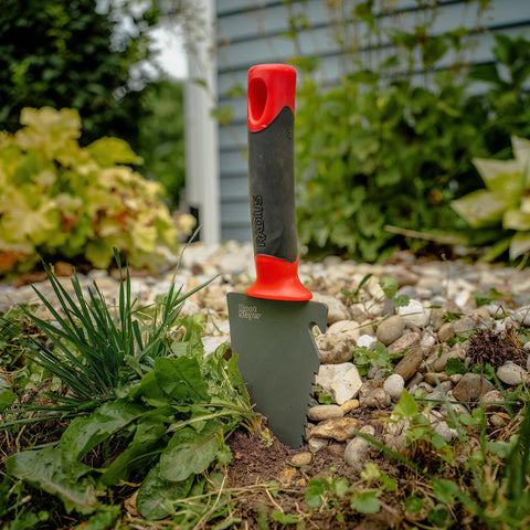 Root Slayer trowel versatile tool for planting, weeding, and soil preparation.