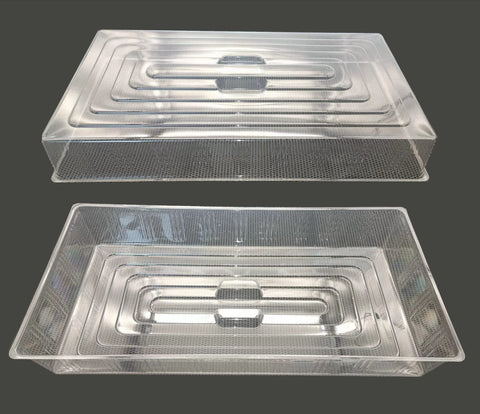 RooTrimmer clear dome cover shown on a seed starter tray for transparent moisture control.