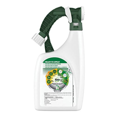 Roundup For Lawns3 applying spray over weeds on a lawn