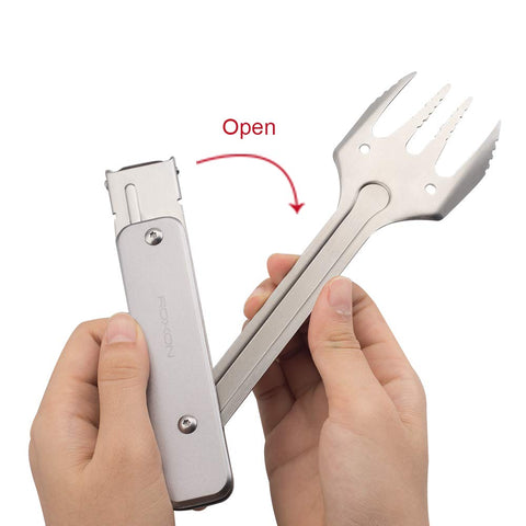 Roxon 4 in 1 tool tongs securing food on grill