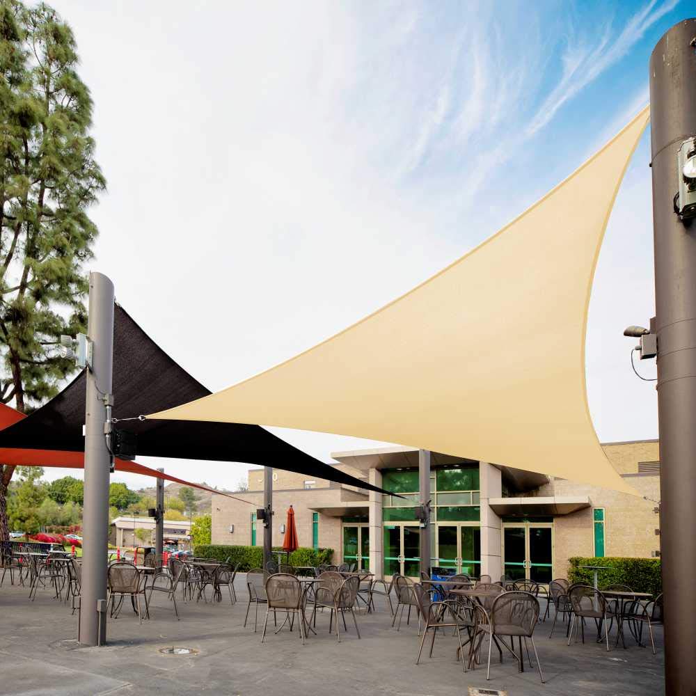 Royal Shade beige triangle shade sail provides patio sun protection.