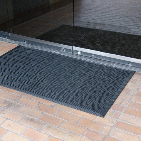 Rubber-Cal Dura-Scraper Checkered keeps entryways clean and dry indoors.