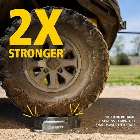 Rubbermaid Brute feeder tie-down slot closeup demonstrates secure ground anchoring.