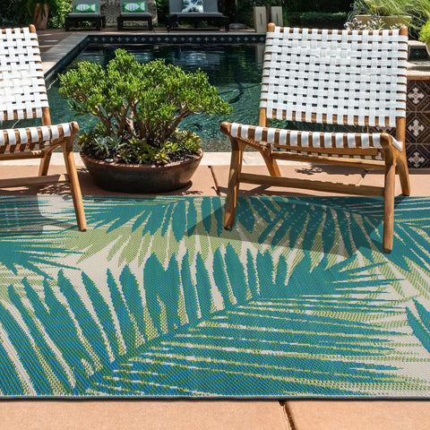 Rugshop tropical floral reversible outdoor rug in sunroom, showcasing indoor-outdoor versatility