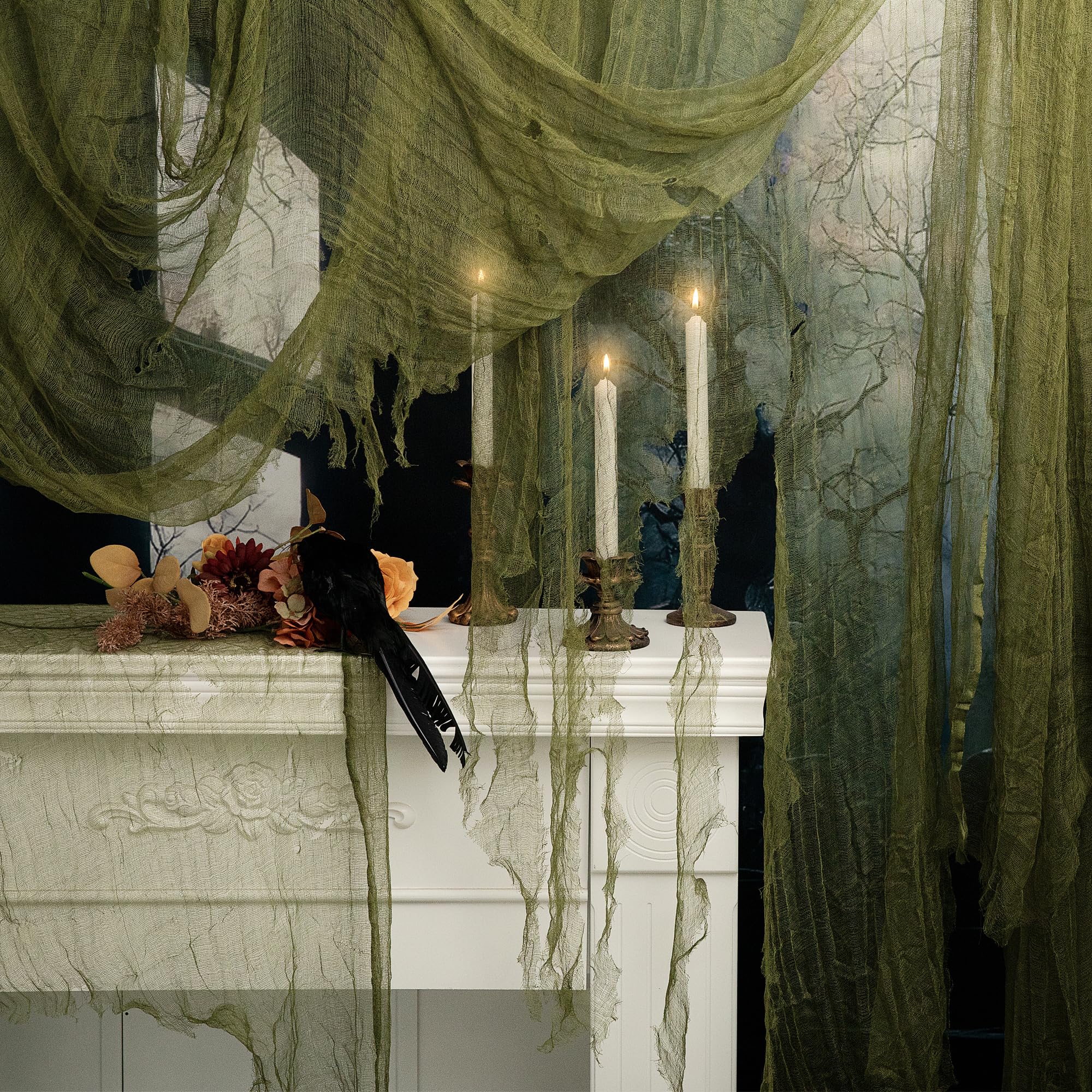 RunNico green Halloween cheesecloth draped on a stairway to create eerie ambiance