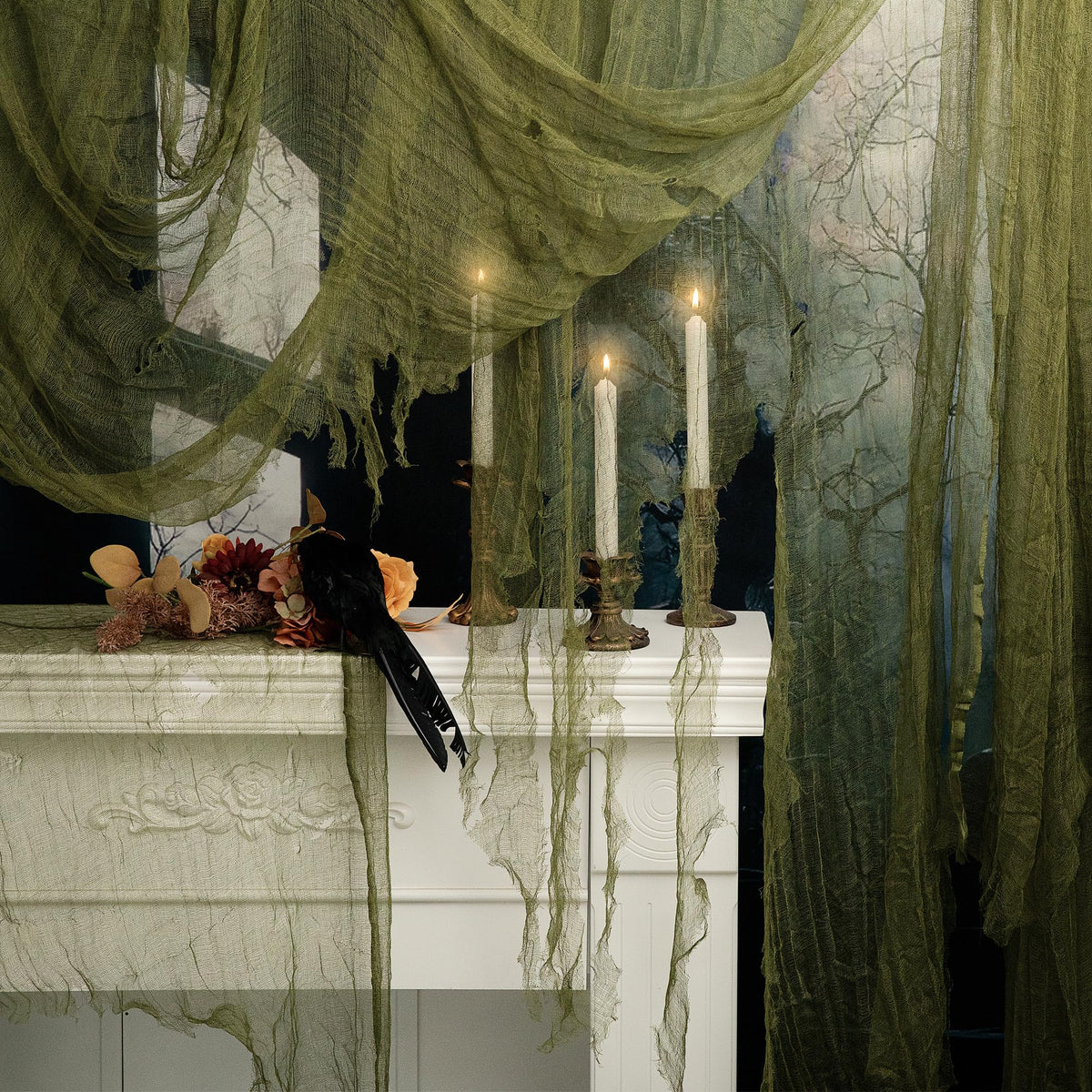 RunNico green Halloween cheesecloth draped on a stairway to create eerie ambiance