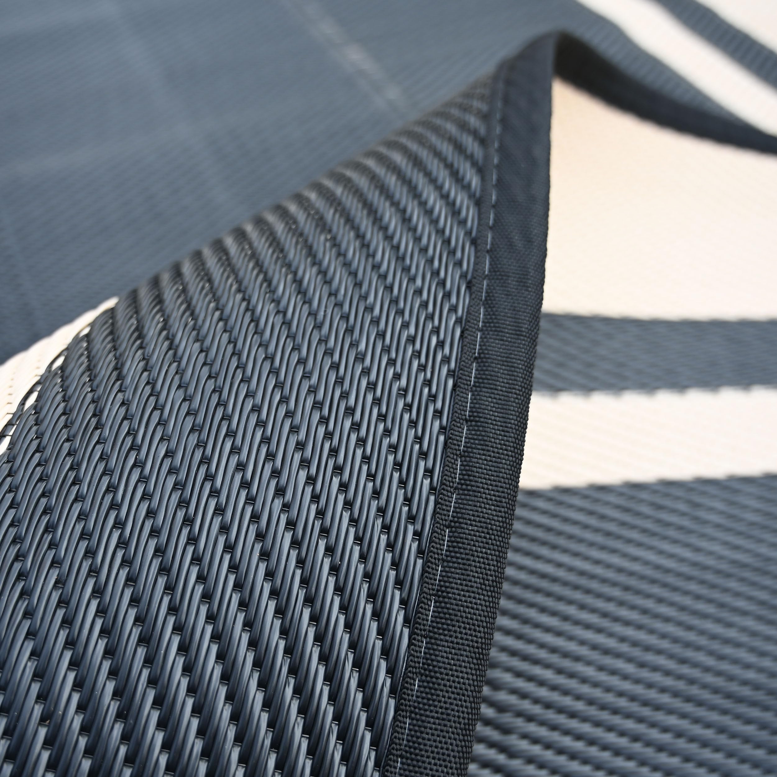 RURALITY lightweight rug rolls up for camping or picnics.