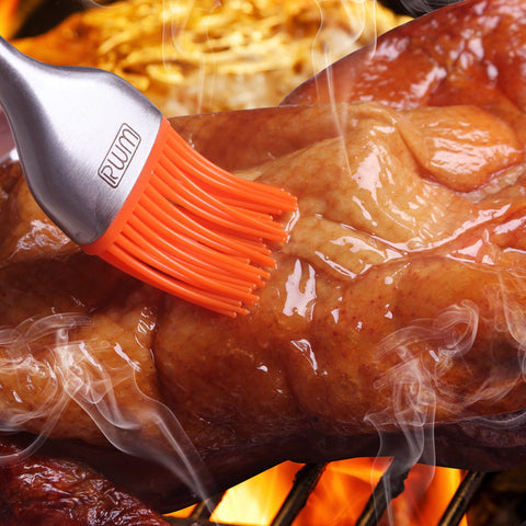 RWM basting brush with removable silicone head in orange for easy dishwasher cleanup.