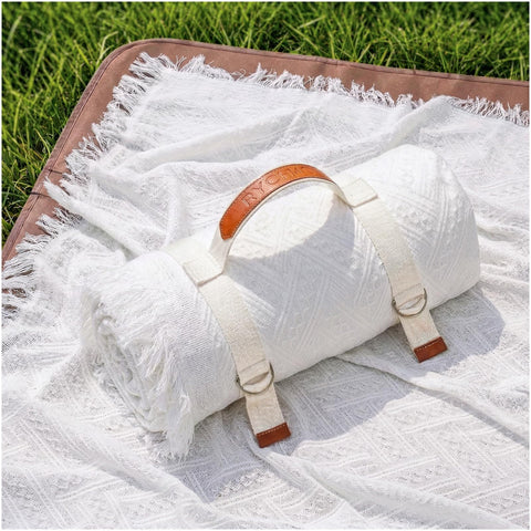 RYCHIC 2-in-1 extra-large camping blanket folded for easy transport and quick setup.