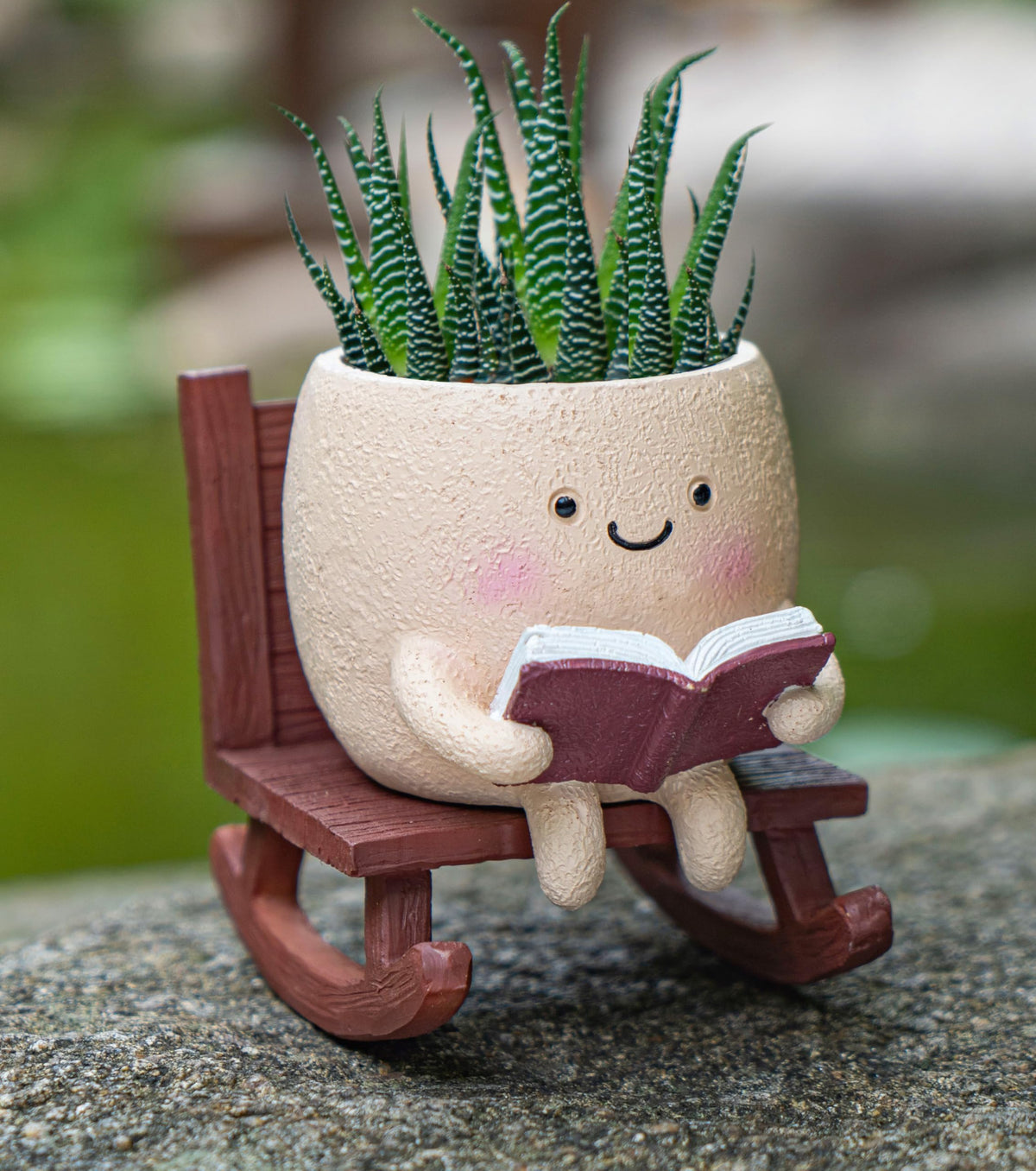 RZOIKZOI rocking chair smiley planter on a stand adds whimsical charm to homes.