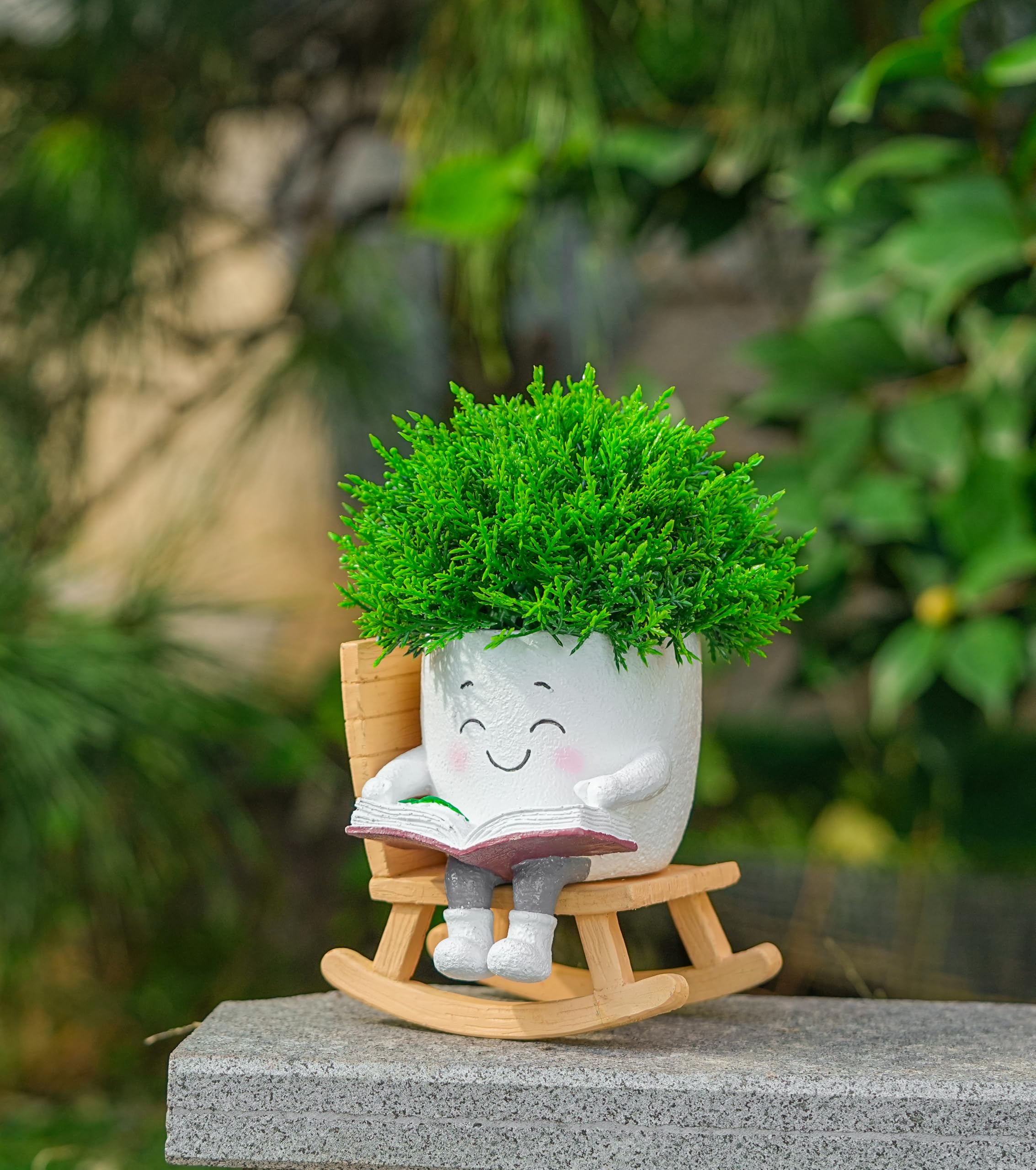 RZOIKZOI smiley-face planter on rocking chair adds playful desk decor