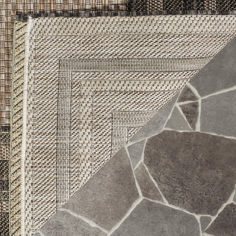 Safavieh Courtyard rug in living room setup proves versatile for high-traffic spaces.