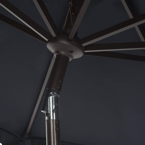 Safavieh UV-resistant fabric umbrella protects seating from sun.