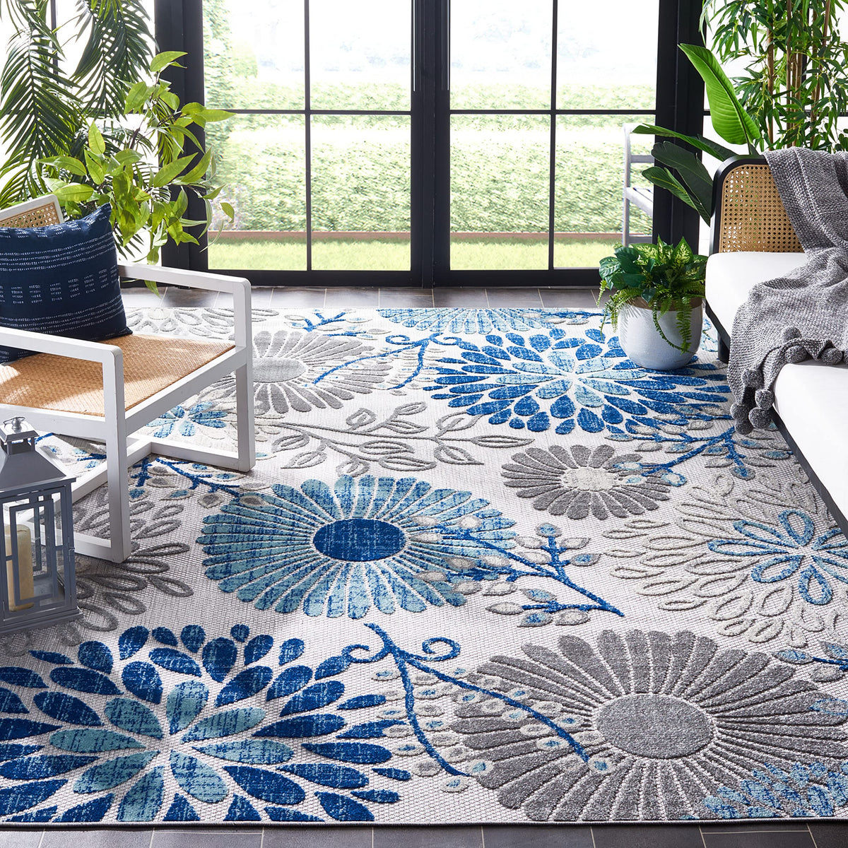 Safavieh Cabana rug gray-blue floral pattern adds outdoor charm and easy cleaning.