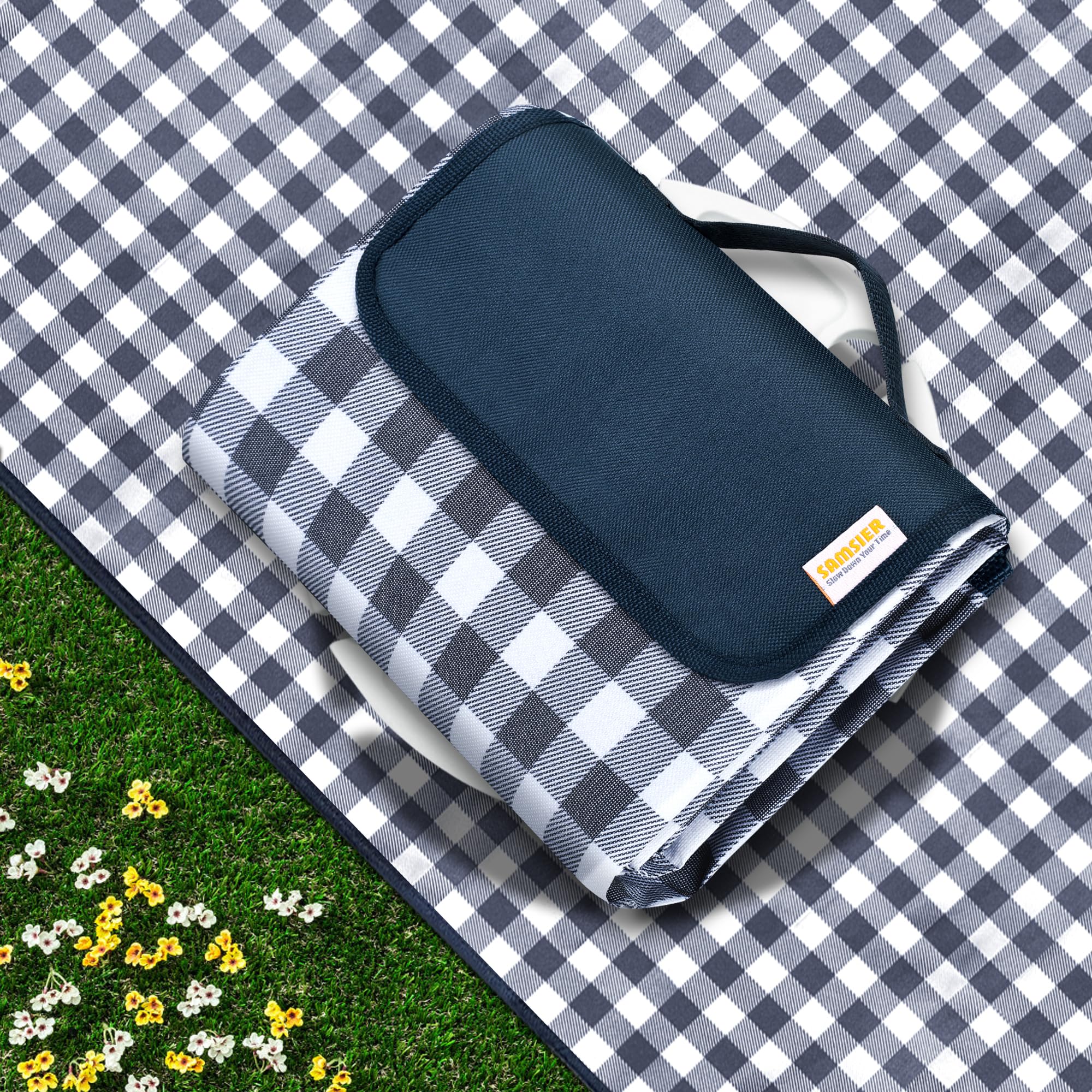 SAMSIER navy outdoor picnic blanket spread on grass for a family picnic.